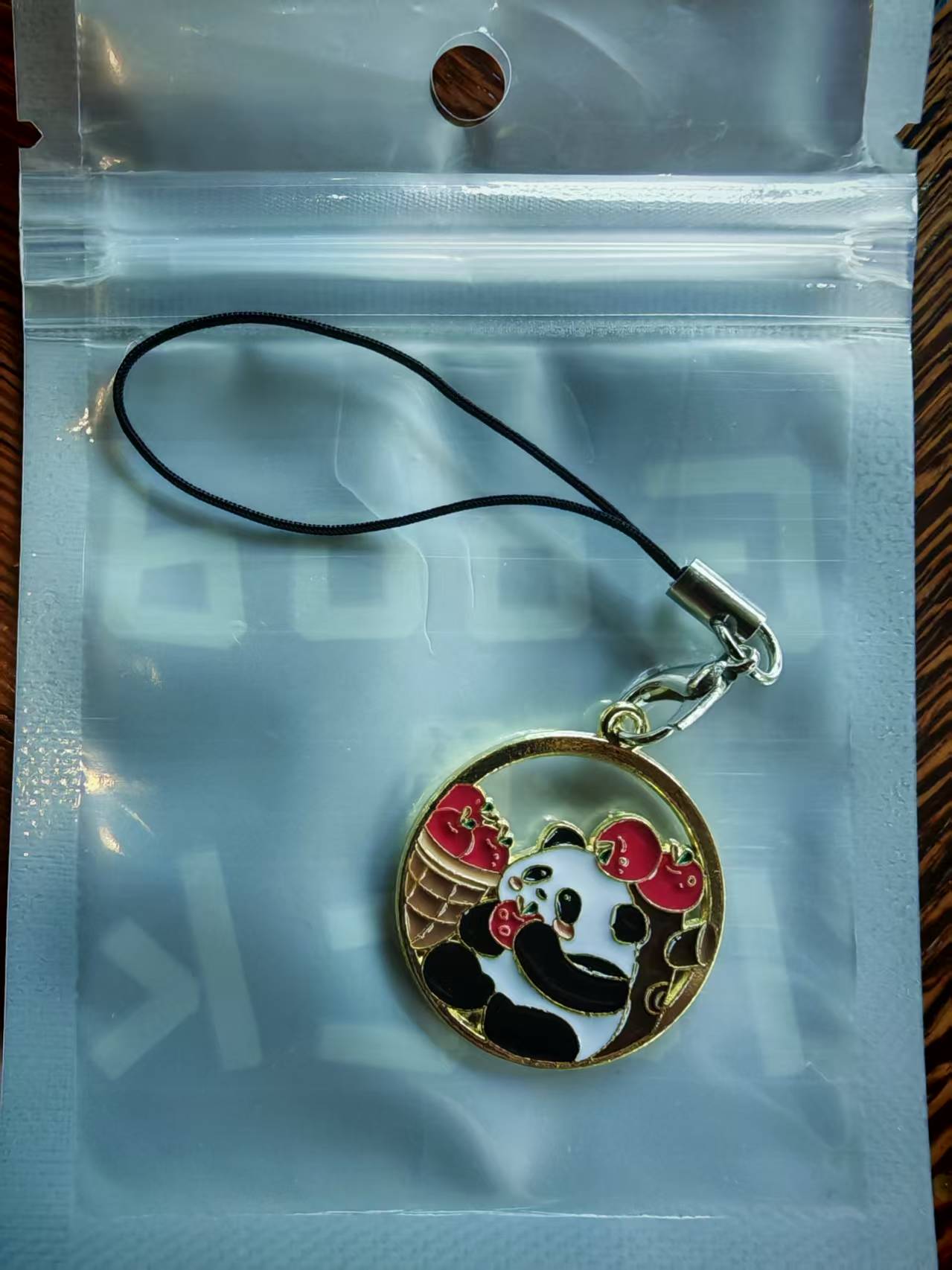Giant panda Hua Hua eats fruit mobile phone chain key pendant